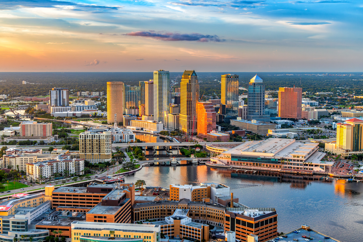 Aerial view of downtown Tampa, Florida, along the banks of the Hillsborough River, shot via helicopter.