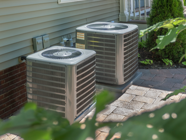 HVAC heating and air conditioning residential units or heat pumps outside of a home.